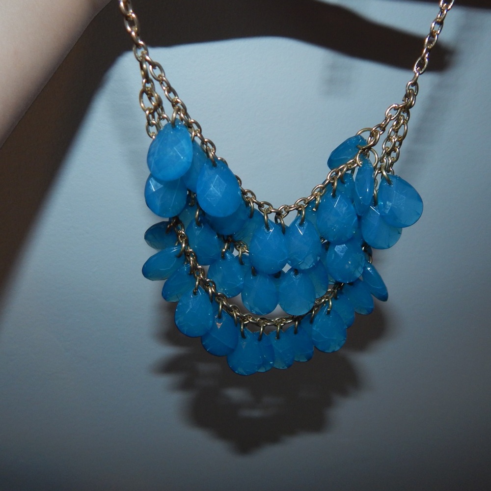 Blue plastic bead necklace with gold chain